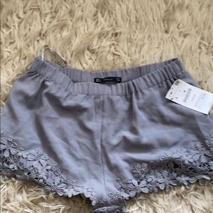 Gray Zara shorts with floral detail